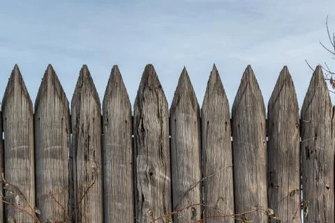 Beautiful horizontal texture of old gray boards with knots and hammered nails Stock Photos