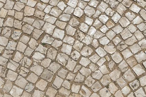 Beautiful horizontal texture of an old path from gray and orange stones with Foto stock