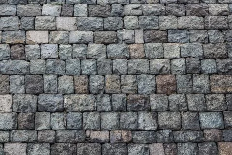 A beautiful horizontal texture of part of an old gray brick wall from frozen Stock-Fotos