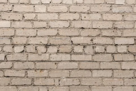 Beautiful horizontal texture of part of a old crashed brick gray wall is on t 스톡 사진