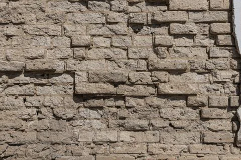 Beautiful horizontal texture of part of an old orange crushed brick wall Stock Photos