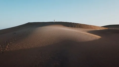 Beautiful horizontal view of sunset over sand desert and blue ocean. Beautiful Stock Footage 95228269