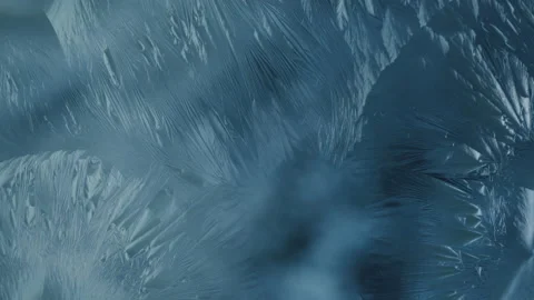 Beautiful ice flowers pattern forming on glass surface, ice flower on window Video stock 140176286