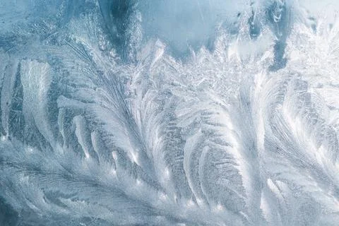 Beautiful ice pattern on a glass window Stock Photos