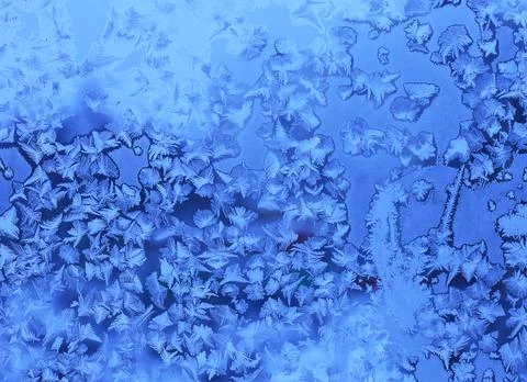 Beautiful ice pattern on winter window glass Stock Photos