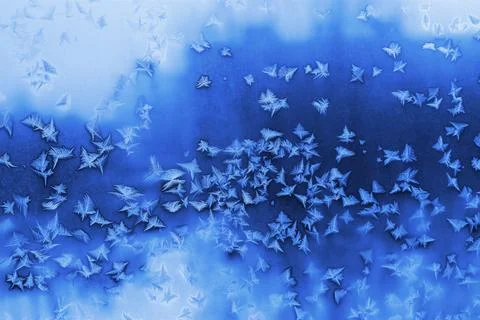 Beautiful ice pattern on winter window glass Stock Photos