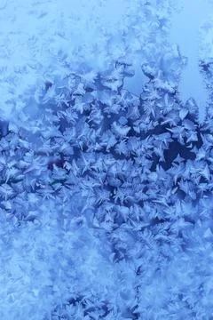 Beautiful ice pattern on winter window glass Stock Photos