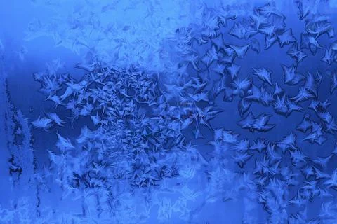 Beautiful ice patterns on winter window Stock-Fotos