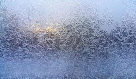 Beautiful ice patterns on winter window Stock Photos