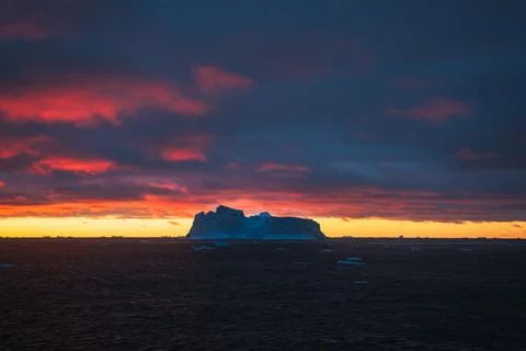 Beautiful Iceberg, Antarctica. Dramatic sunset Stock Photos