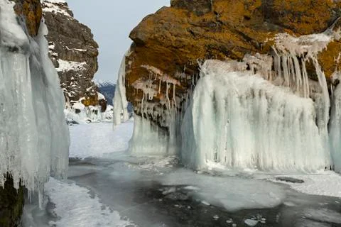 Beautiful icicles on rocks Stock Photos