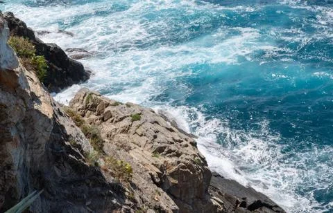 Beautiful Image Of Ocean Waves Rolling And Breaking On Sharp Cliffs And Rocks Stock Photos