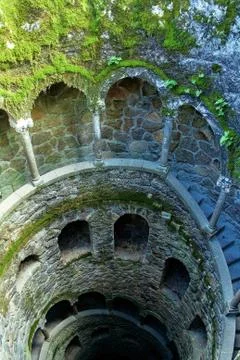 A beautiful image of the wall of a tower with windows and stairs from inside. Stock Photos