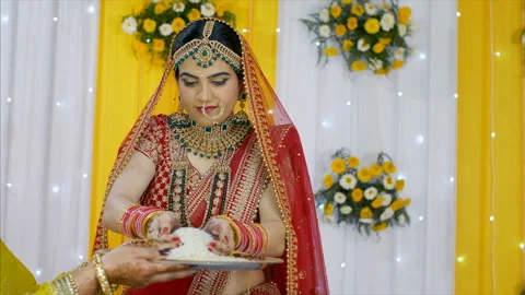 Beautiful Indian bride performing wedding rituals wearing a traditional lehenga Stock Footage 156649826