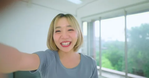 Beautiful influencer talking to camera with smiling. Stock Footage 249300697