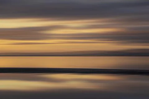 Beautiful Intentional camera movement image of vibrant colorful sunset landsc Stock Photos