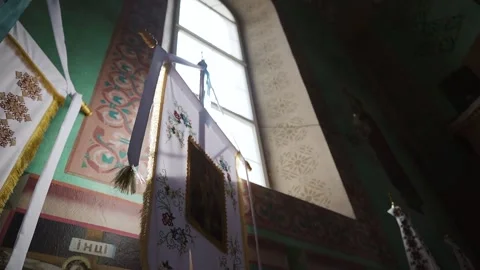 The beautiful interior of an orthodox temple. Crane shot of the sunlight window Stock Footage 221017424