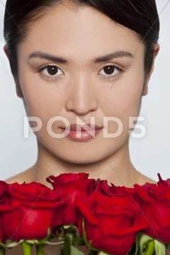 Beautiful japanese girl with roses Stock Photos