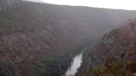 Beautiful Krka river landscape shot with rainfall autumn colors Video stock 87766853