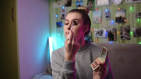 A beautiful lady doing her face makeup for the party - getting ready Stock Footage 219850958