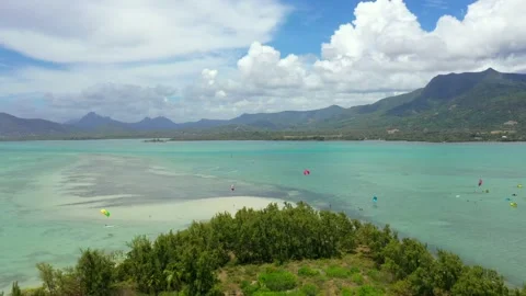 Beautiful lagoon, clouds, mountains and kiteboarders on the Mauritius island Stock Footage 145256095