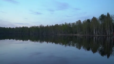Beautiful lake in the forest at sunset Stock Footage 240954939