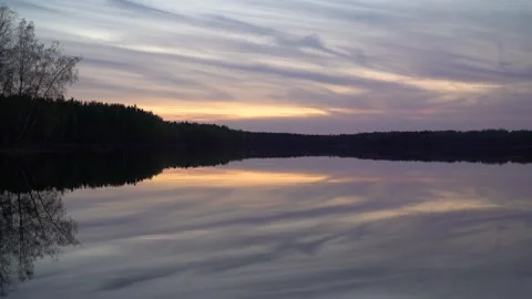 Beautiful lake in the forest at sunset Stock Footage 240954940