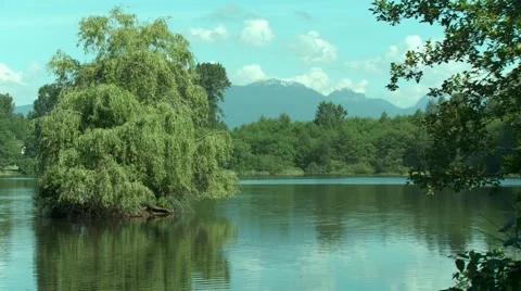 Beautiful lake with mountains at the background 스톡 동영상 58140796