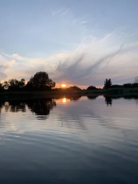 Beautiful lake sunset background wit Stock Photos