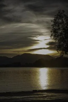 Beautiful lake view,before sunset,reflection of sunlight over mountain shinin Stock Photos