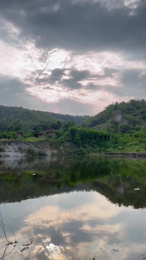 Beautiful lake when silhouetted by light in the afternoon Stock Footage 312398141