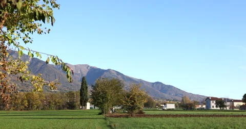 Beautiful landscape and view on a small village with high mountains sunny day Stock Footage 239110011