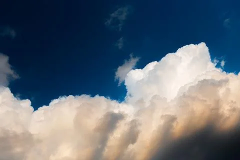 Beautiful landscape of cloudy sky, partial dark, fluffy clouds. Natural lands Stock Photos