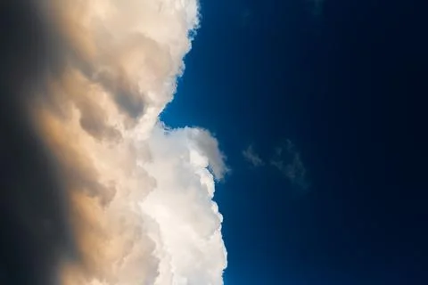 Beautiful landscape of cloudy sky, partial dark, fluffy clouds. Natural lands Stock Photos