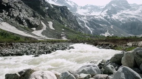 Beautiful landscape with a fast mountain river flowing between rocky stones Stock Footage 162584748