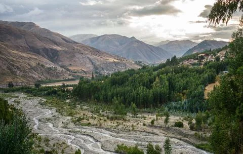 Beautiful landscape featuring an array of lush green trees, with distant mountai 스톡 사진
