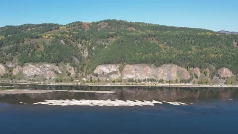Beautiful landscape flight over the river bank with rocks Stockbeeldmateriaal 219610694