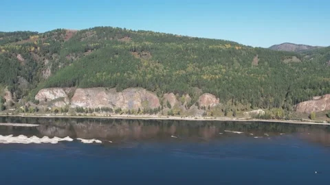Beautiful landscape flight over the river bank with rocks Stockbeeldmateriaal 219610805