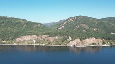 Beautiful landscape flight over the river bank with rocks Stockbeeldmateriaal 219611621