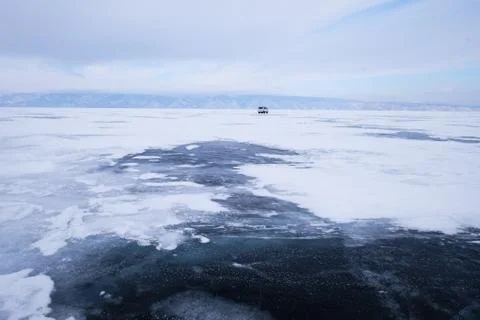 A beautiful landscape of frozen ais in the layer of Lake Baikal in Russia Stock Photos