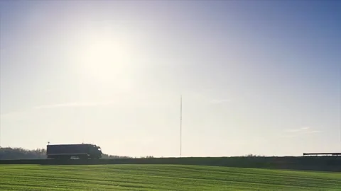 Beautiful landscape with highway along which large truck with trailer Stock Footage 88450933