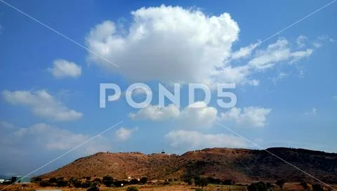 Beautiful Landscape with hill, blue sky and white cloud Stock Photos