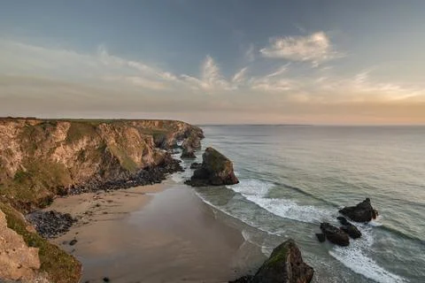 Beautiful landscape image during Spring golden hour on Cornwall coastline at  Stock Photos
