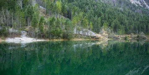 Beautiful landscape mountain forest reflection in still  lake water Stock Photos