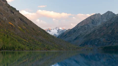 Beautiful landscape with a mountain range and snow on the peak are reflected in Stock Footage 46636101