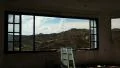 Beautiful landscape out of wide window of an abandoned hotel HD Footage