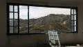 Beautiful landscape out of wide window of an abandoned hotel HD Footage