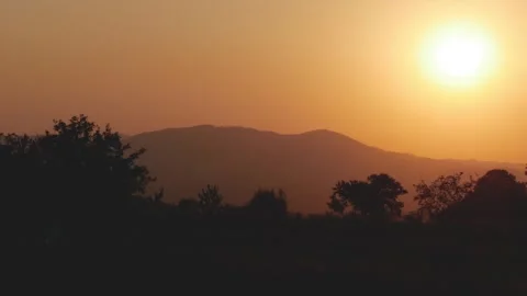 Beautiful Landscape with a Red Sunset in a Mountain Dusk. Alpine Sunset View Stock Footage 336916850