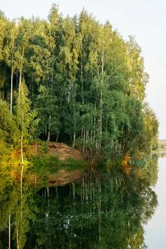 Beautiful landscape on the river with reflection during sunset. Stock Photos