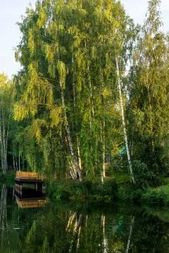 Beautiful landscape on the river with reflection during sunset. Stock Photos